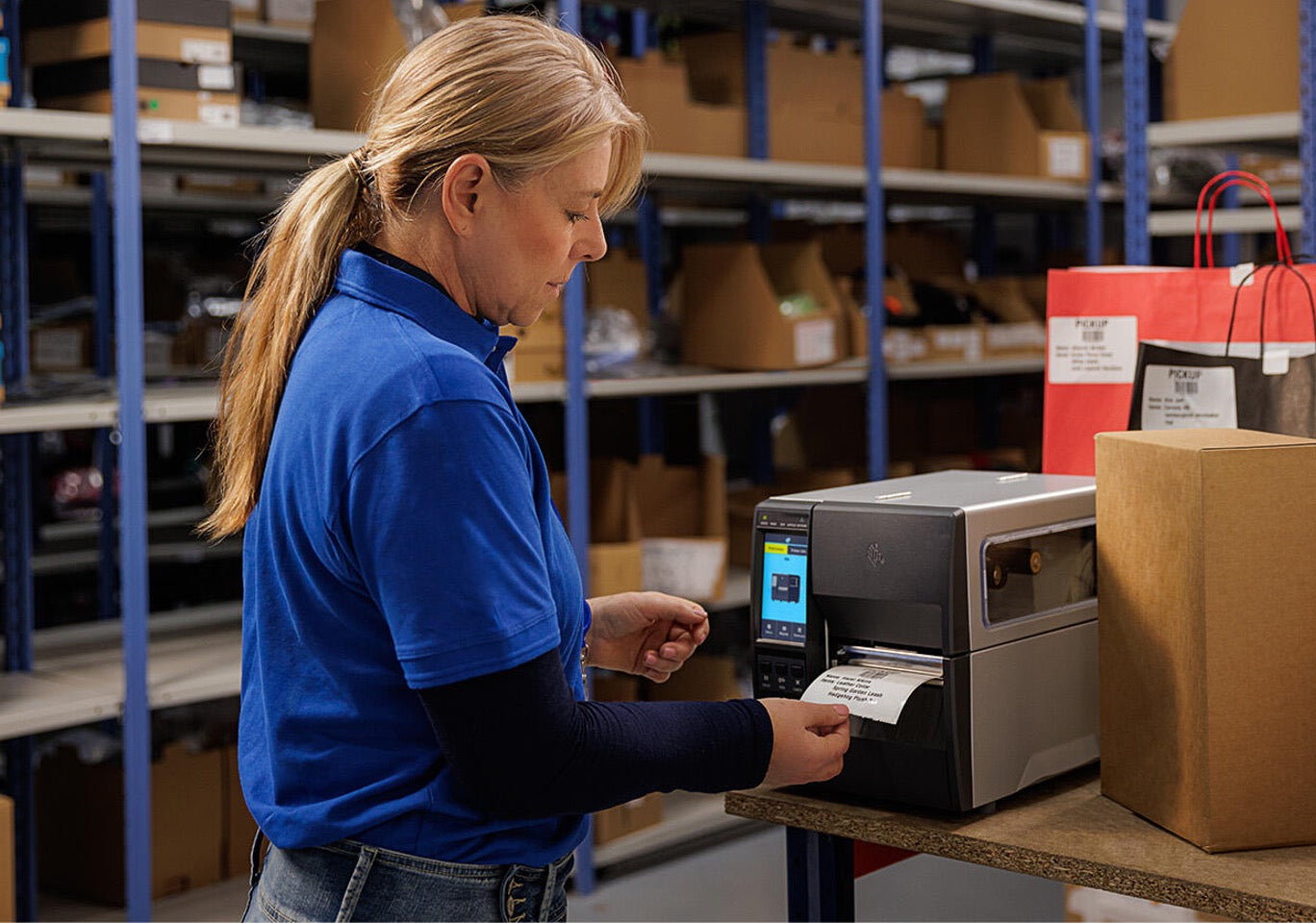 woman holding label printed from label printer